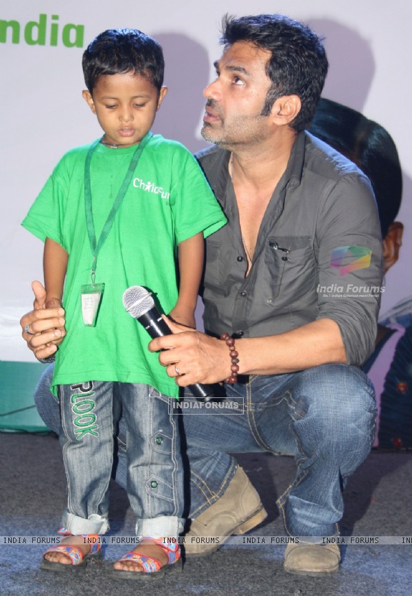 Bollywood actor Sunil Shetty with underprivileged children at the ChildFun day organized by ChildFund India, in New Delhi on Wednesday. .