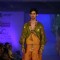 Model walks the ramp for WLC Chimera fashion show at Leela Hotel