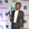 Nawazuddin Siddiqui holds up his black lady at the 59th Idea Filmfare Awards 2013