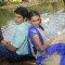 Mohan and Bhakti sitting near a lake