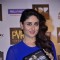 Kareena Kapoor holds a Singham Returns Merchandise at the Launch