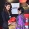 Priyanka Chopra gifts a boxing glove to a fan at the Promotions of Mary Kom at Reliance Outlet