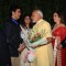 Narendra Modi felicitated with a bouquet of flowers at the Launch of HN Reliance Foundation Hospital