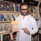 Saif Ali Khan poses with a book at the Promotions of Happy Ending