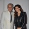 Dalip Tahil poses with a guest at ITT Travel Exhibition