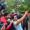 Varun Dhawan takes a selfie with fans at Promotions of Marvel's Captain America