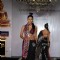 Models show Shobhaa De sarees for Samsaara